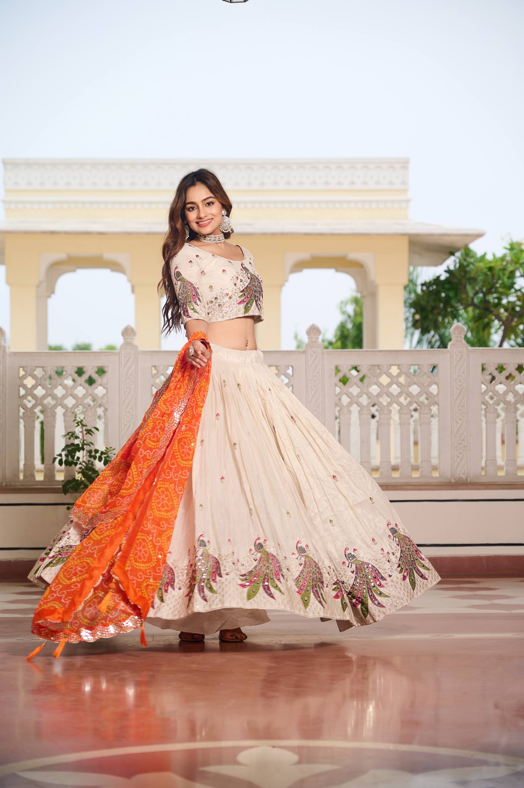 Wonderful Embroidery Work White Color Lehenga With Orange Dupatta