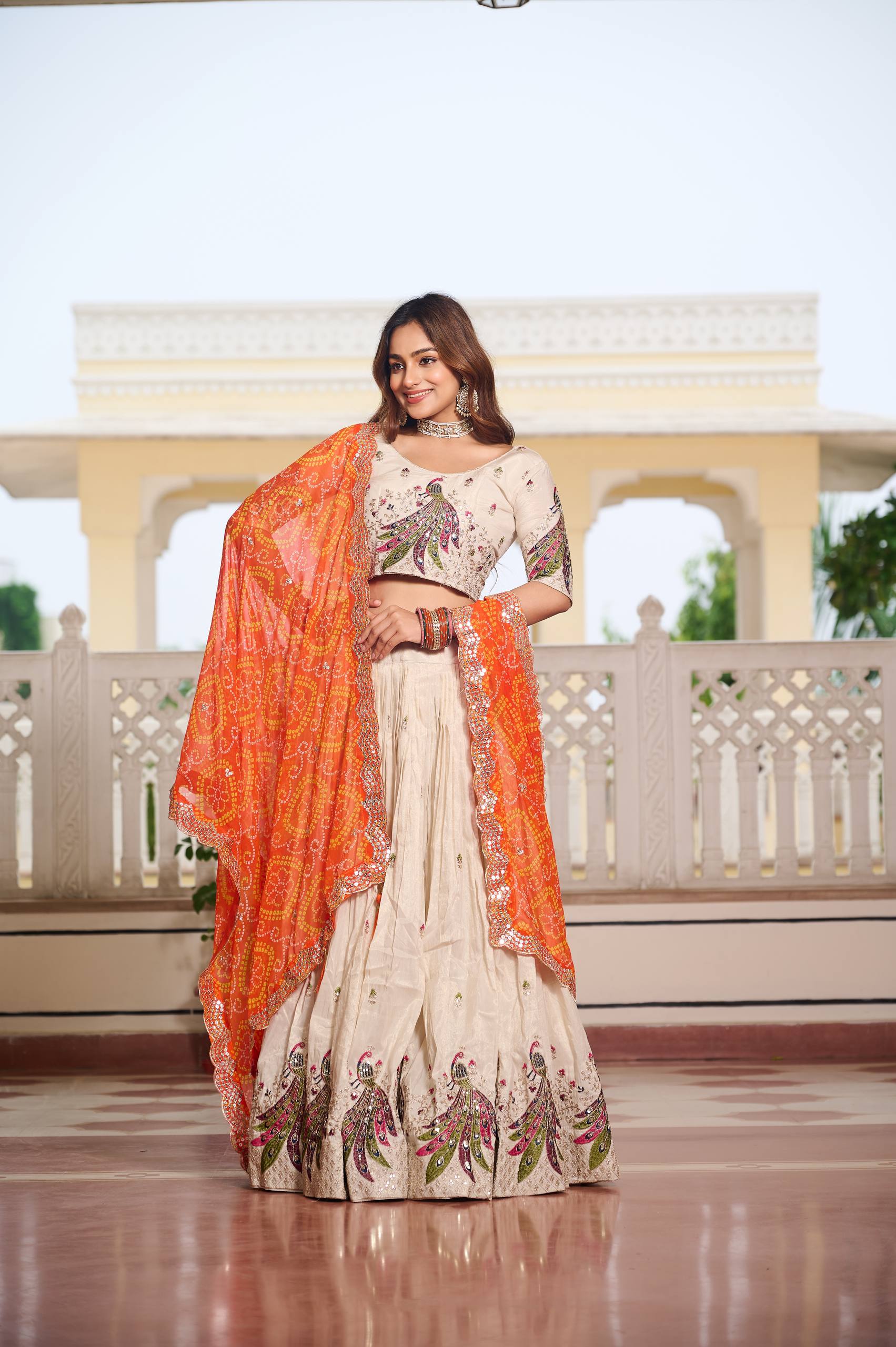Wonderful Embroidery Work White Color Lehenga With Orange Dupatta