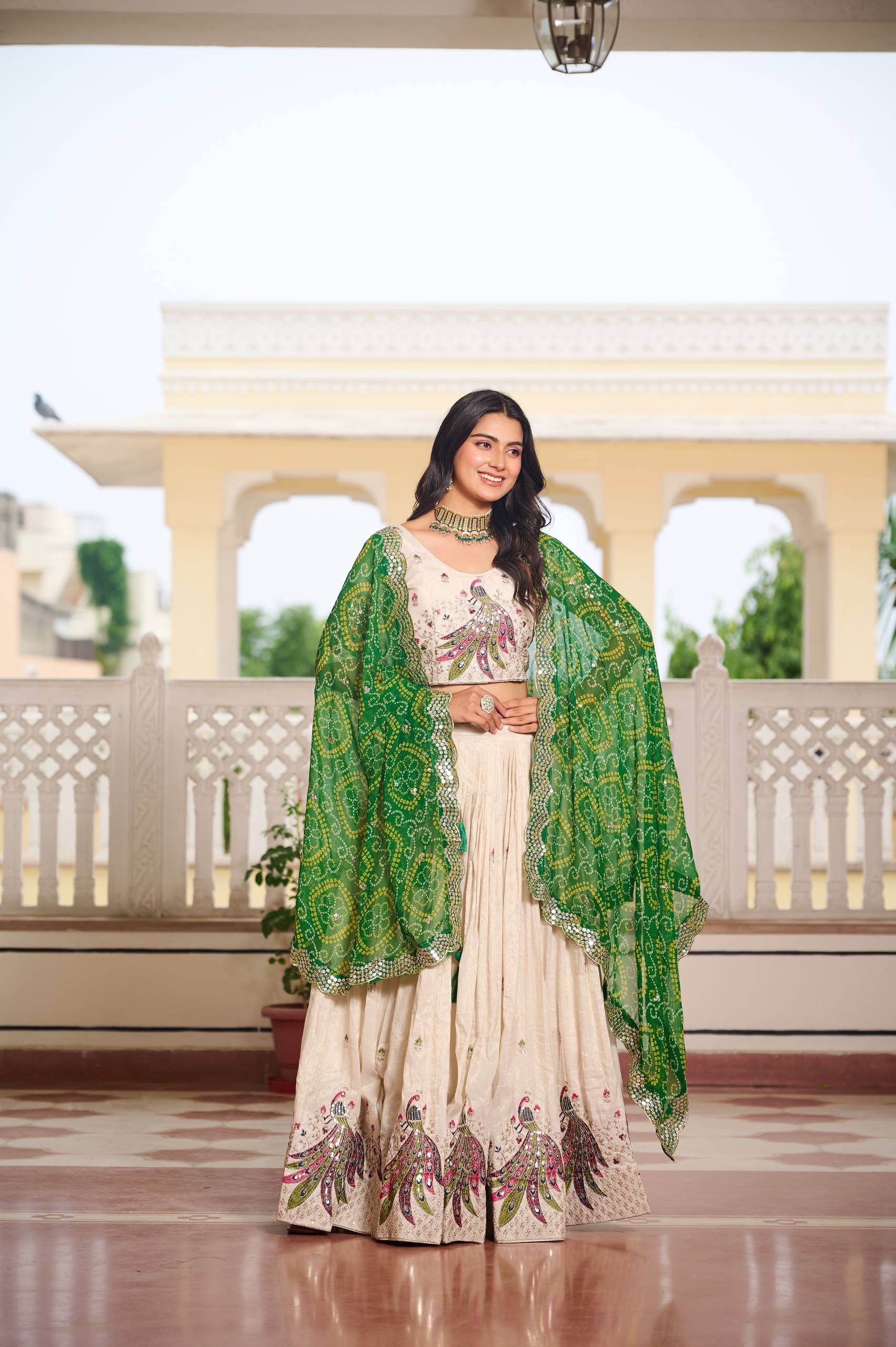 Wonderful Embroidery Work White Color Lehenga With Green Dupatta